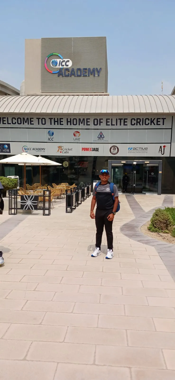 Coach at the ICC Academy Dubai entrance — Home of Elite Cricket
